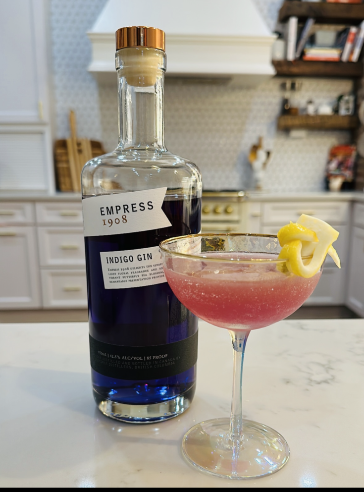 Easy Summer Gin cocktail with gin, agave syrup, and fresh lemon juice in coupe glass with a lemon twist